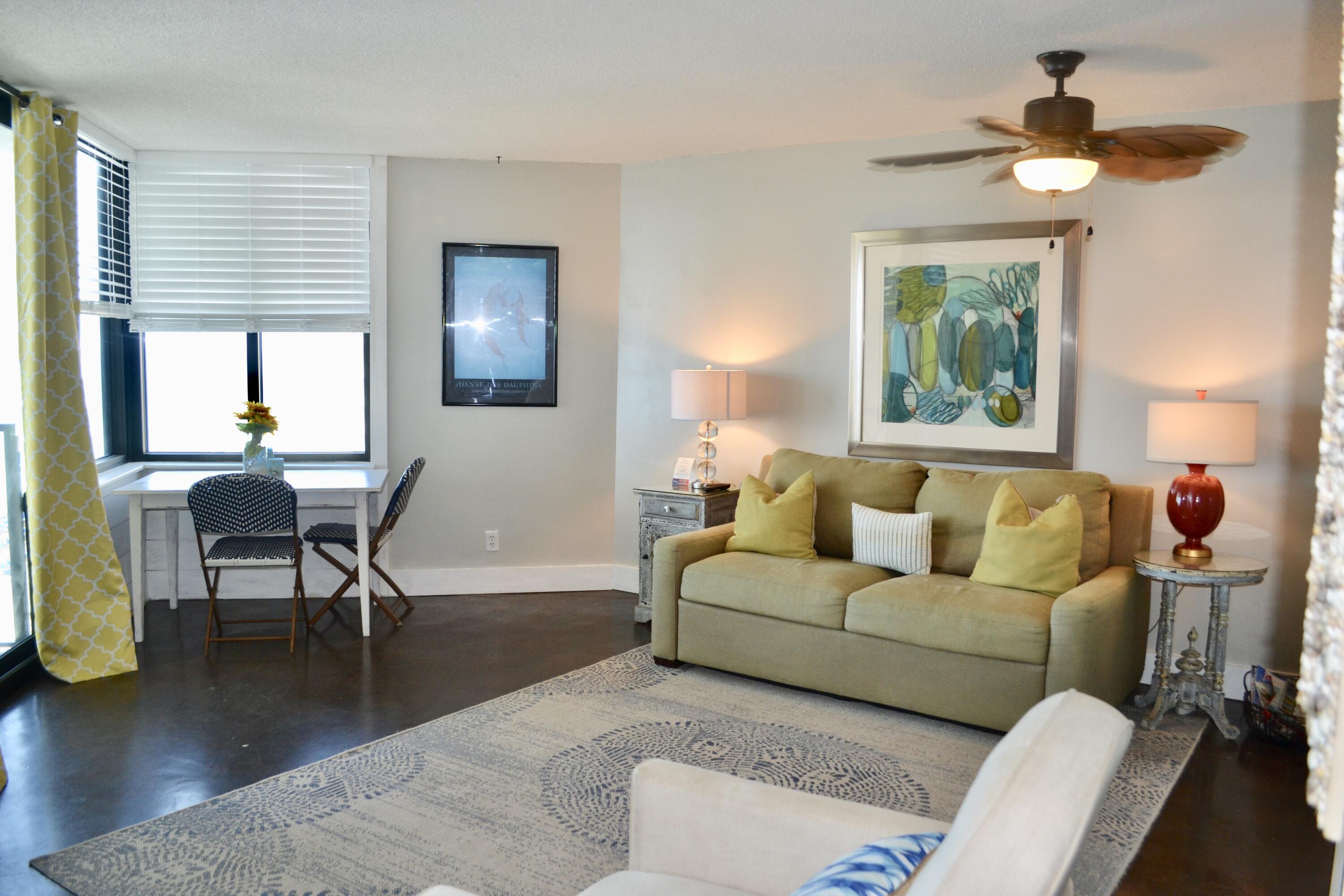 a living room with furniture and a window