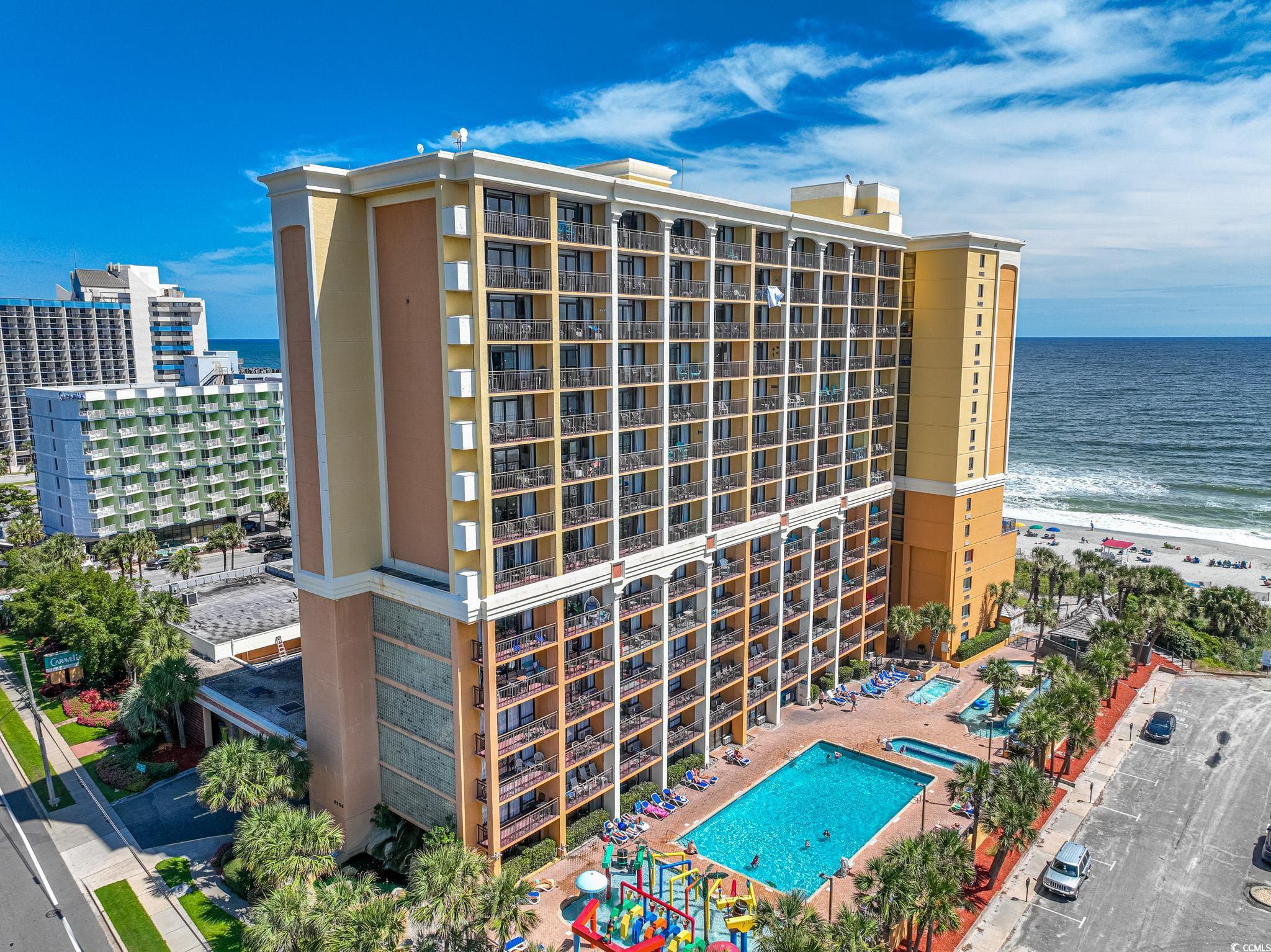 View of building exterior with a view of the beach