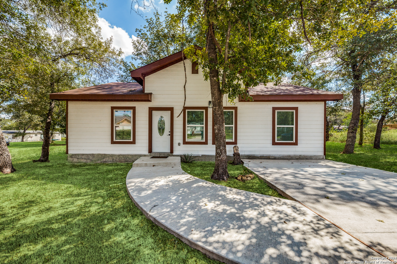 front view of a house with a yard