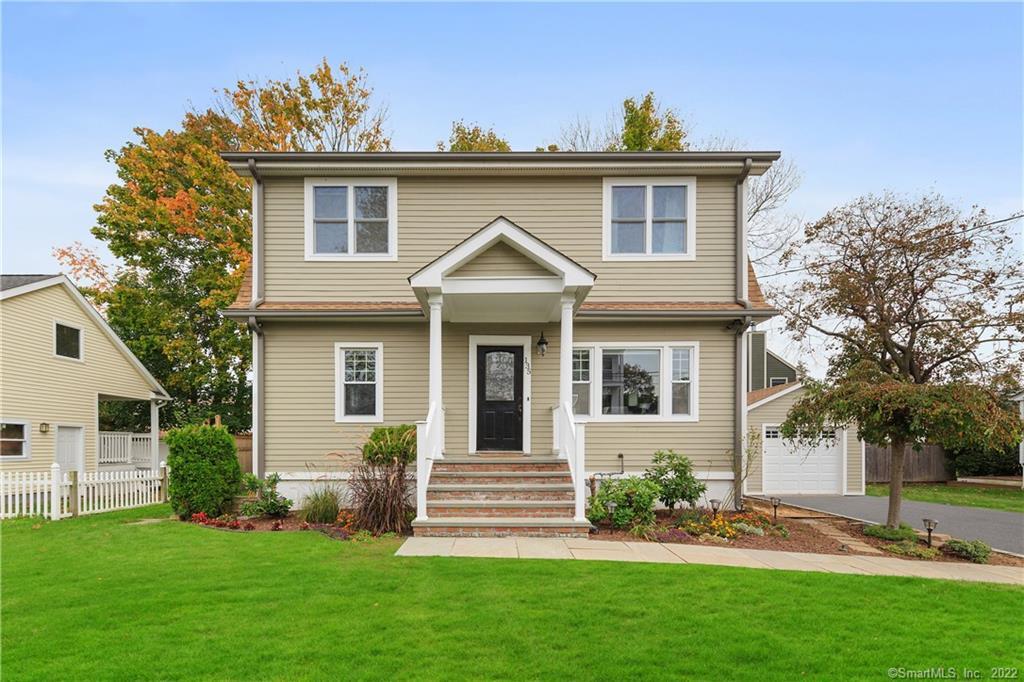 a front view of a house with a yard