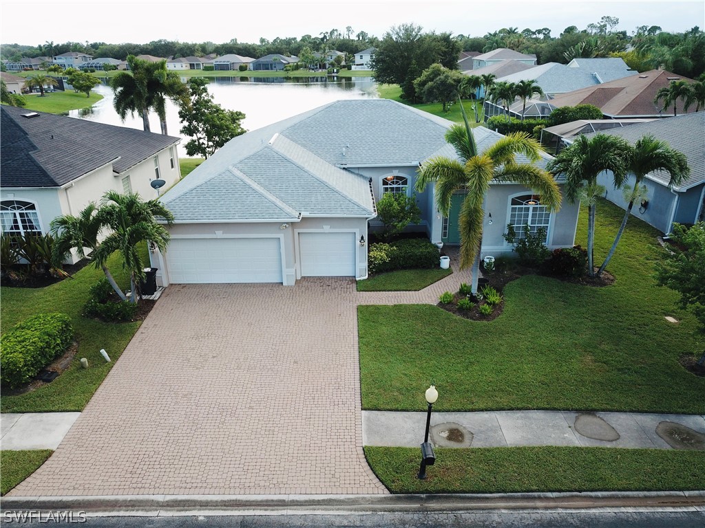 a aerial view of a house with a yard