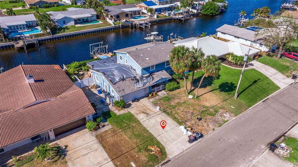 an aerial view of a house with outdoor space