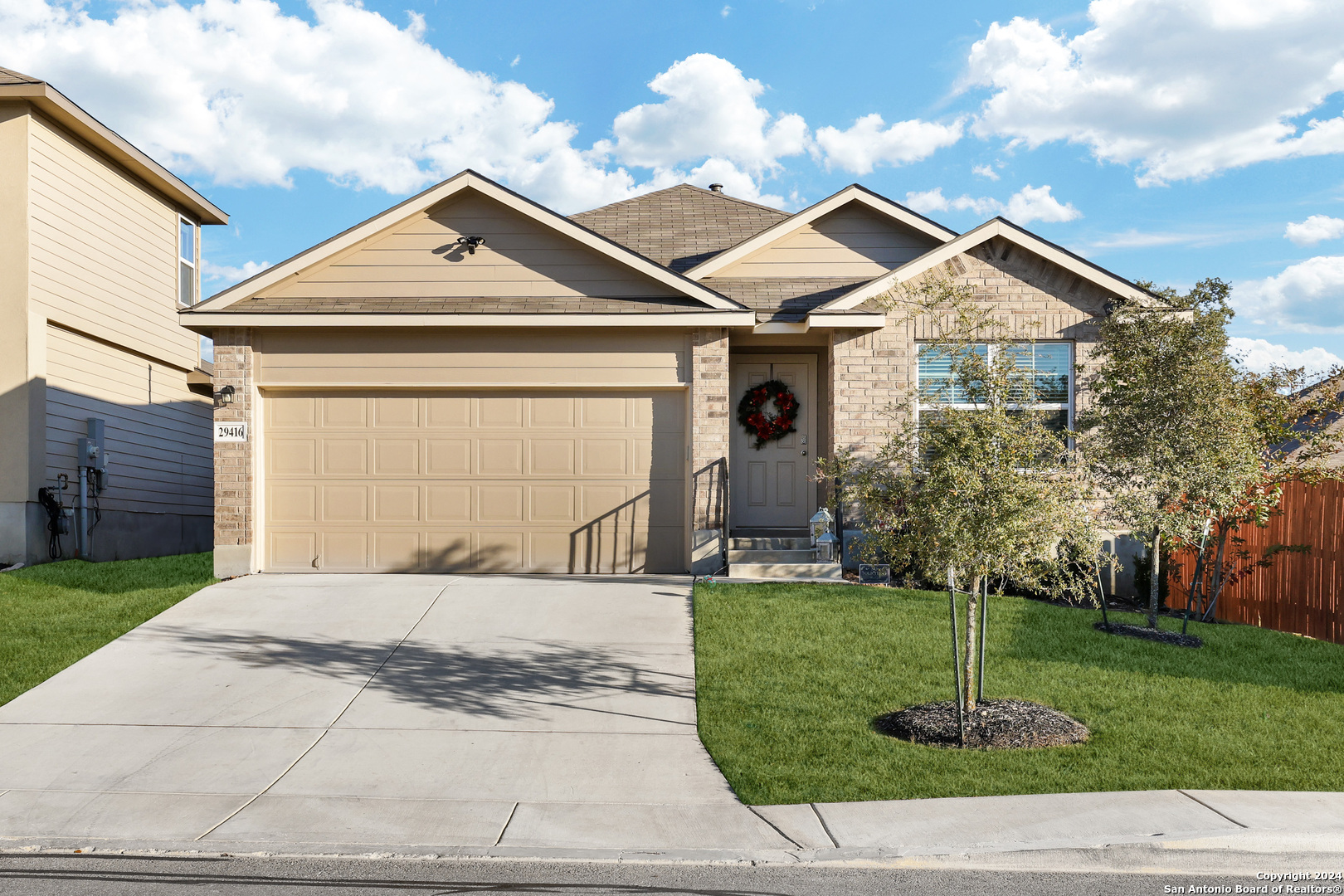 a front view of a house with a yard