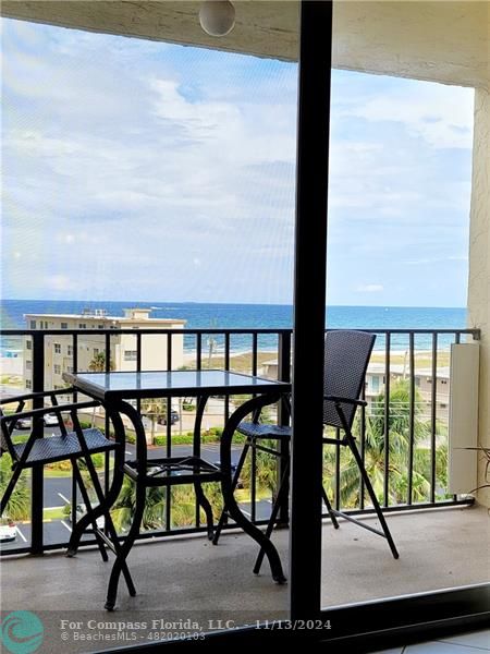 a view of a porch with furniture