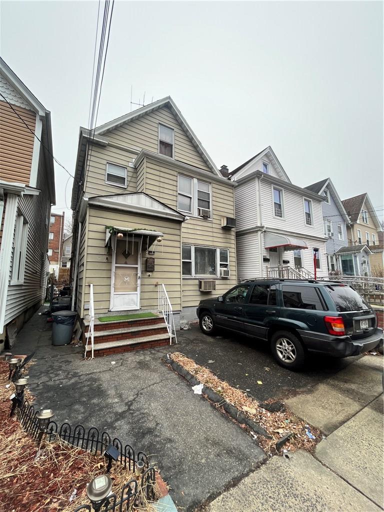 a car parked in front of a house