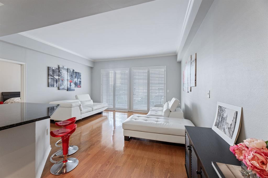 a bedroom with furniture and wooden floor