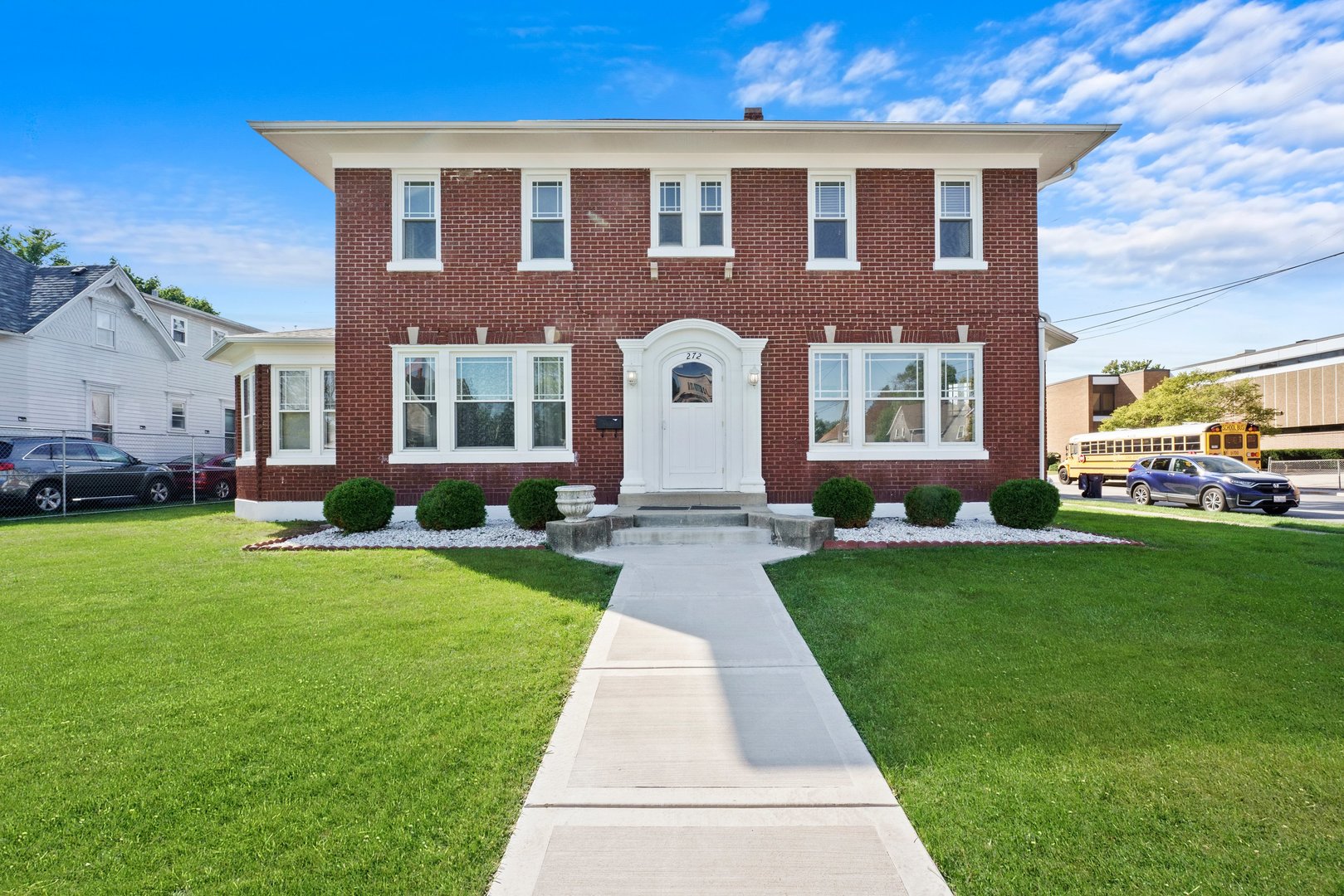 a front view of a house with a yard