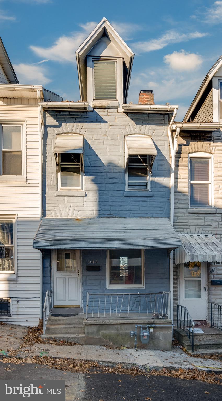 a front view of a house with yard