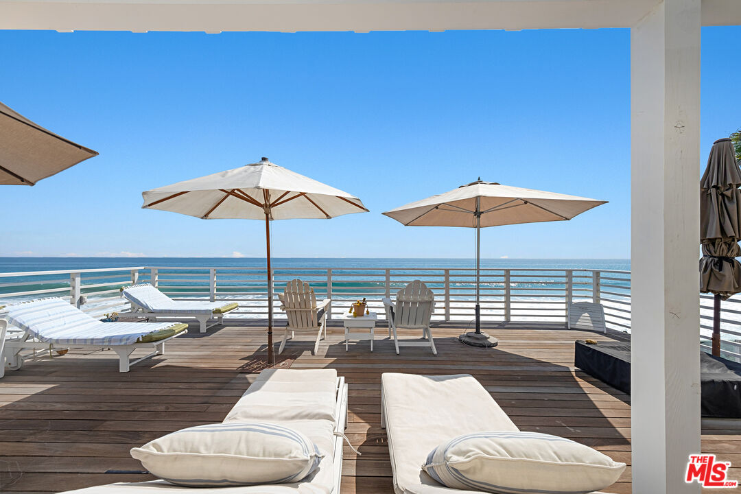 a outdoor space with furniture and umbrella