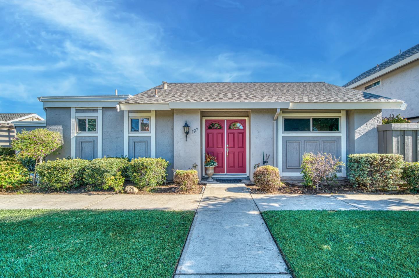 a front view of a house with yard