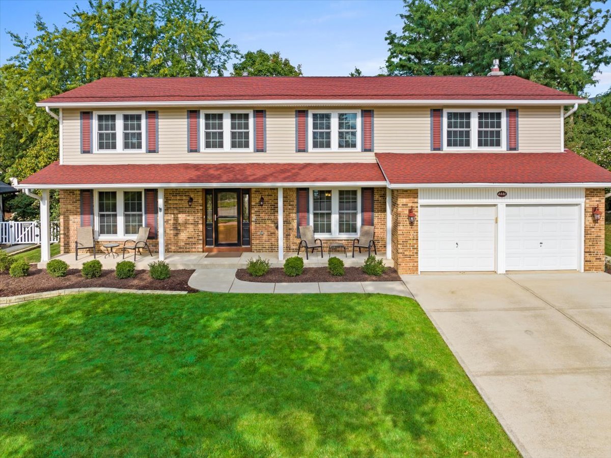 a front view of a house with a yard patio and fire pit