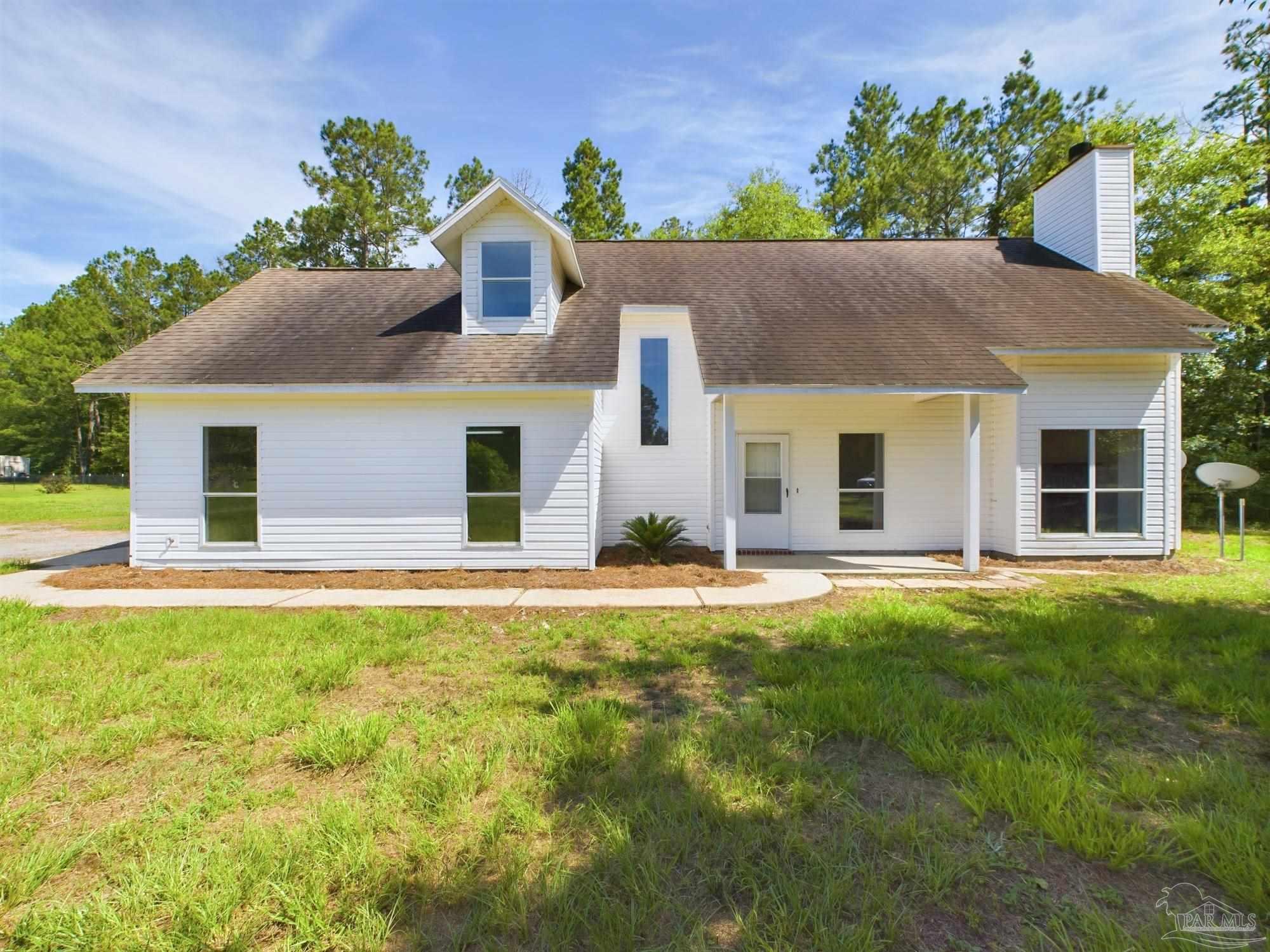 front view of a house with a yard