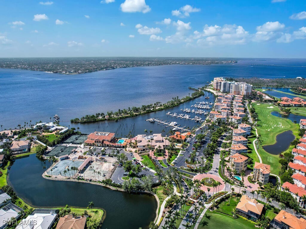 an aerial view of a house with a lake view