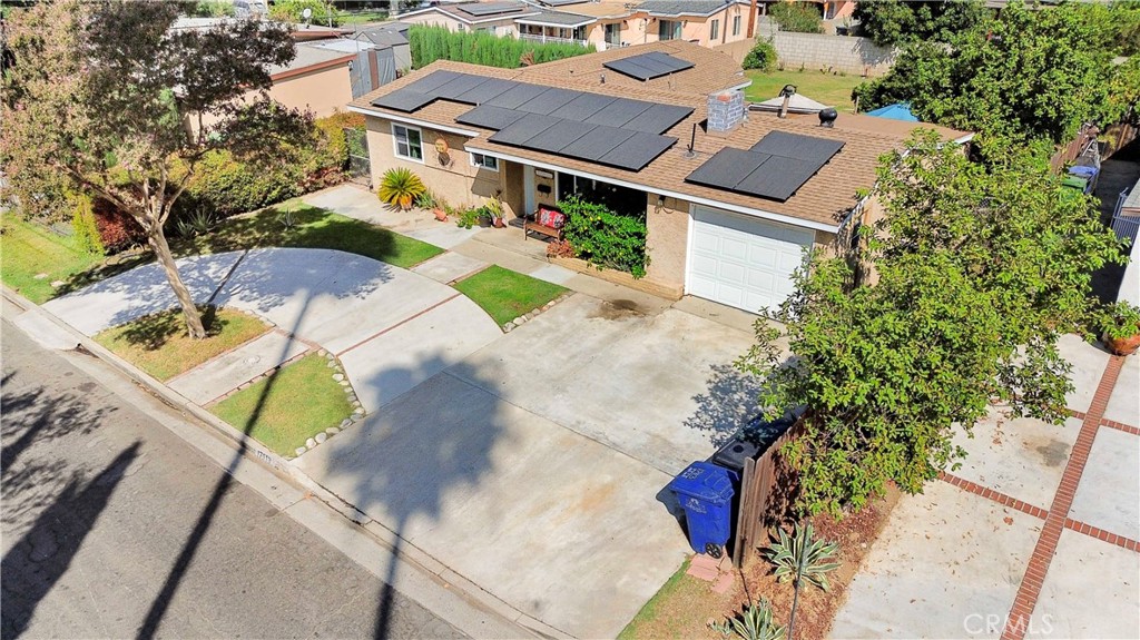 an aerial view of house with yard