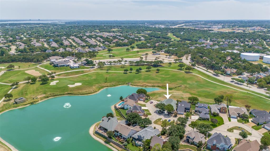 an aerial view of a residential houses with outdoor space