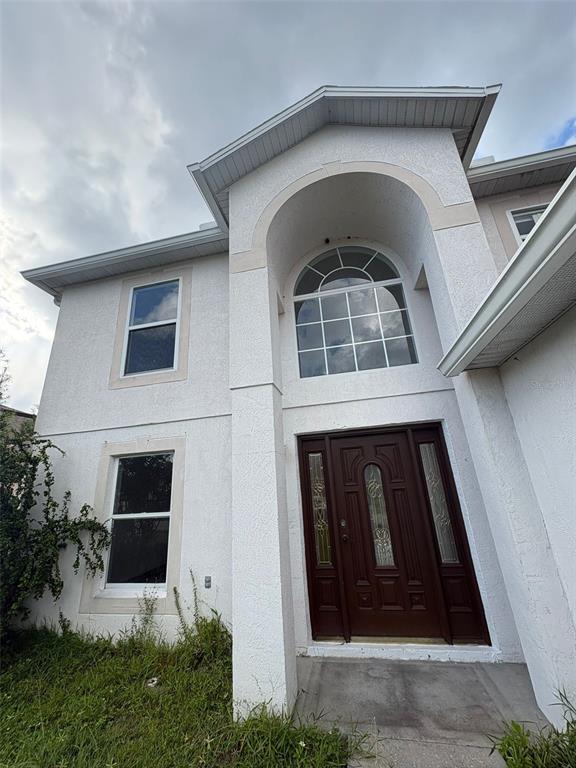 a front view of a house with garage