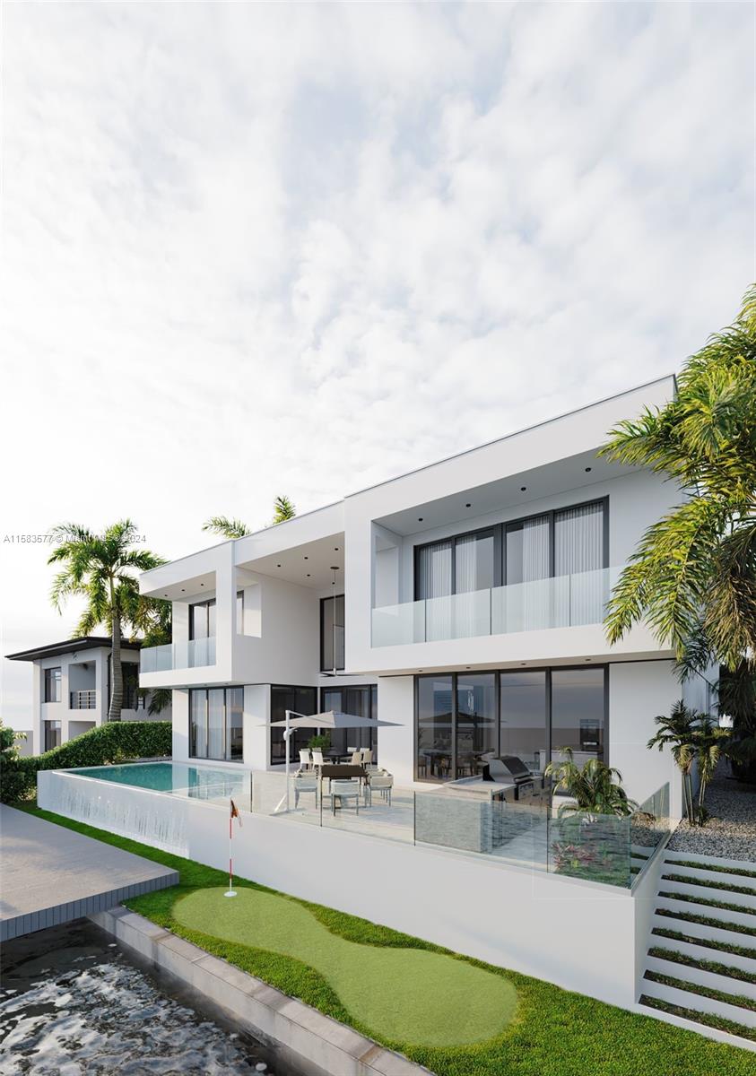 a view of a house with backyard porch and sitting area