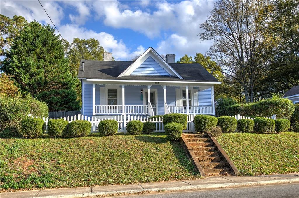 front view of a house with a yard