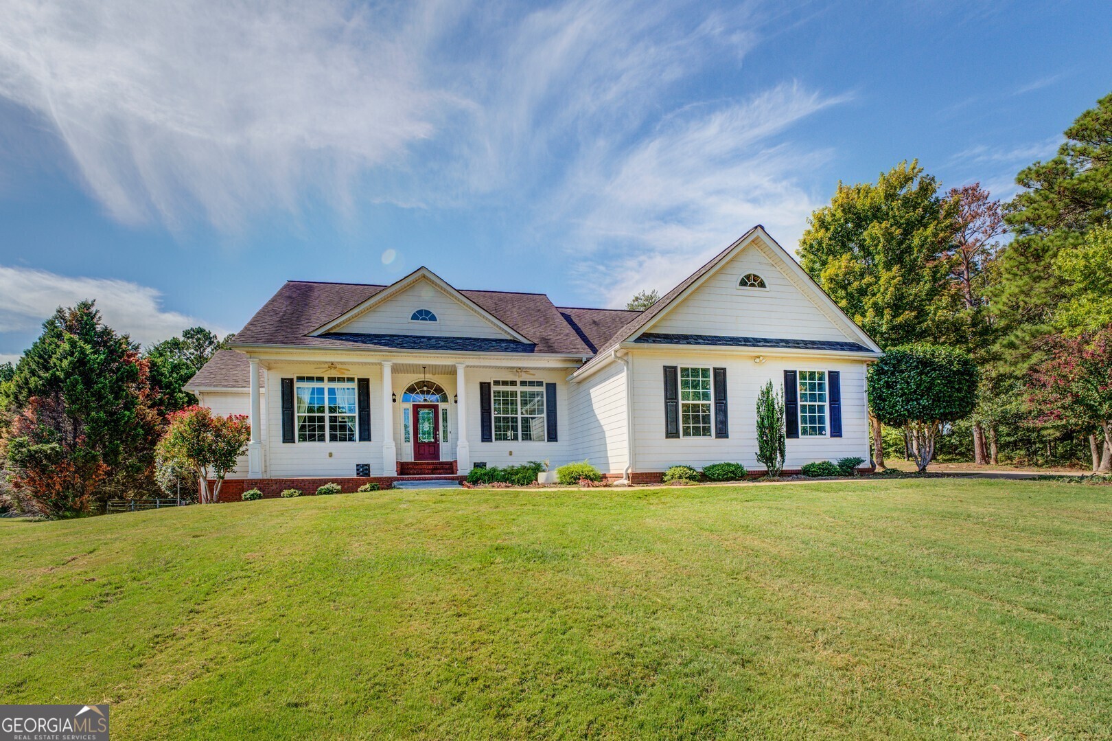 a front view of a house with a yard