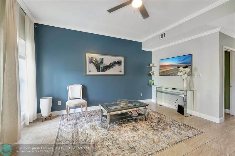 a living room with furniture and a rug