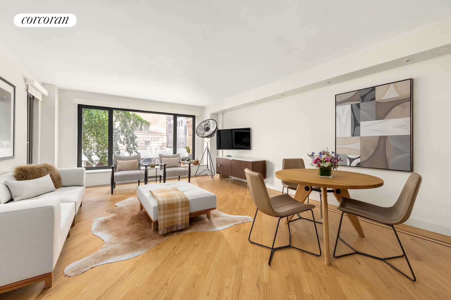 a living room with furniture and a flat screen tv