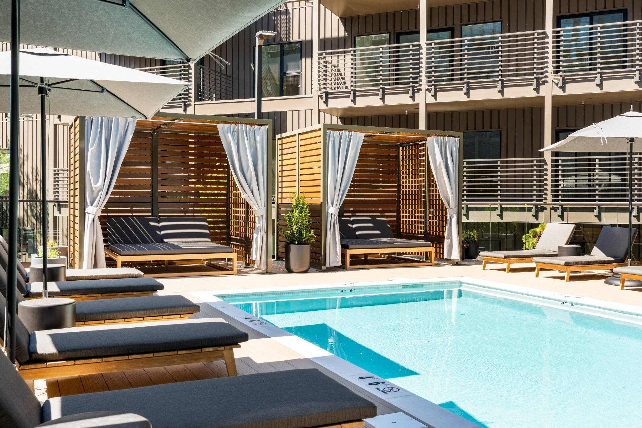 a view of swimming pool with chairs