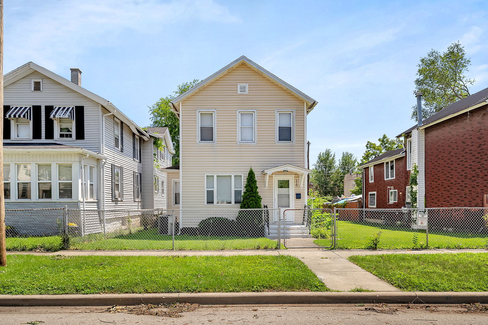 a front view of a house with a yard