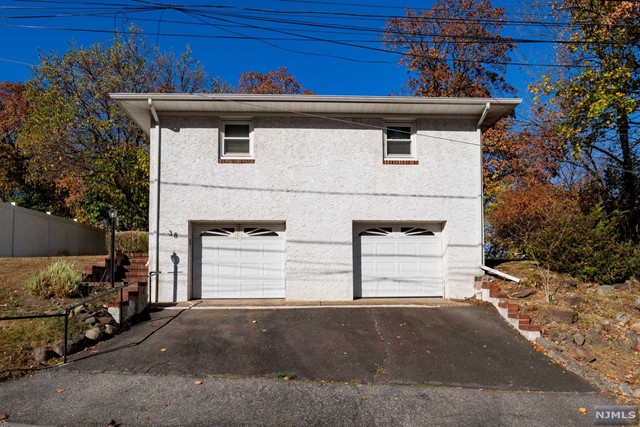 a front view of a house with a garage