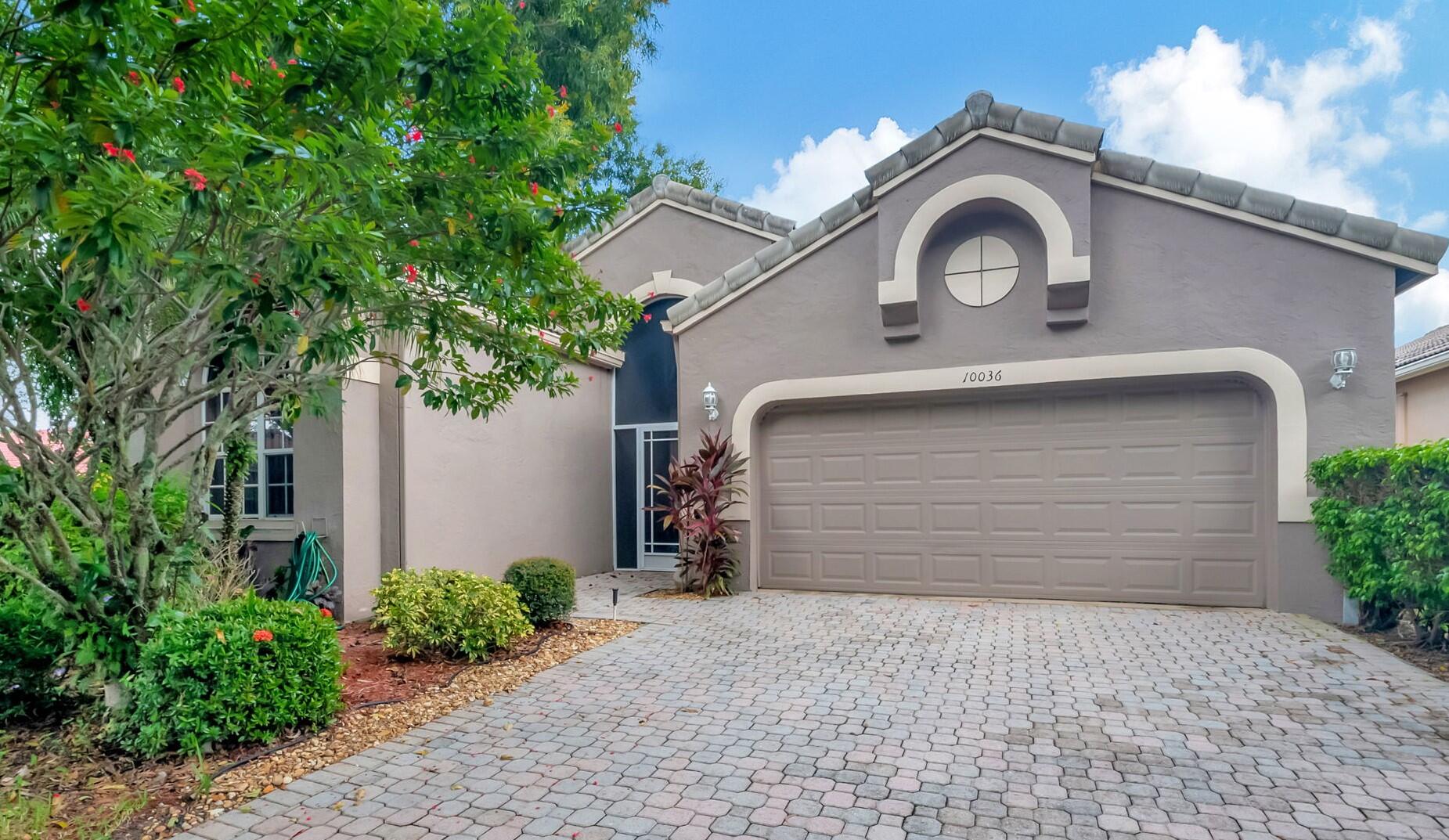 a front view of a house with a garage and garage