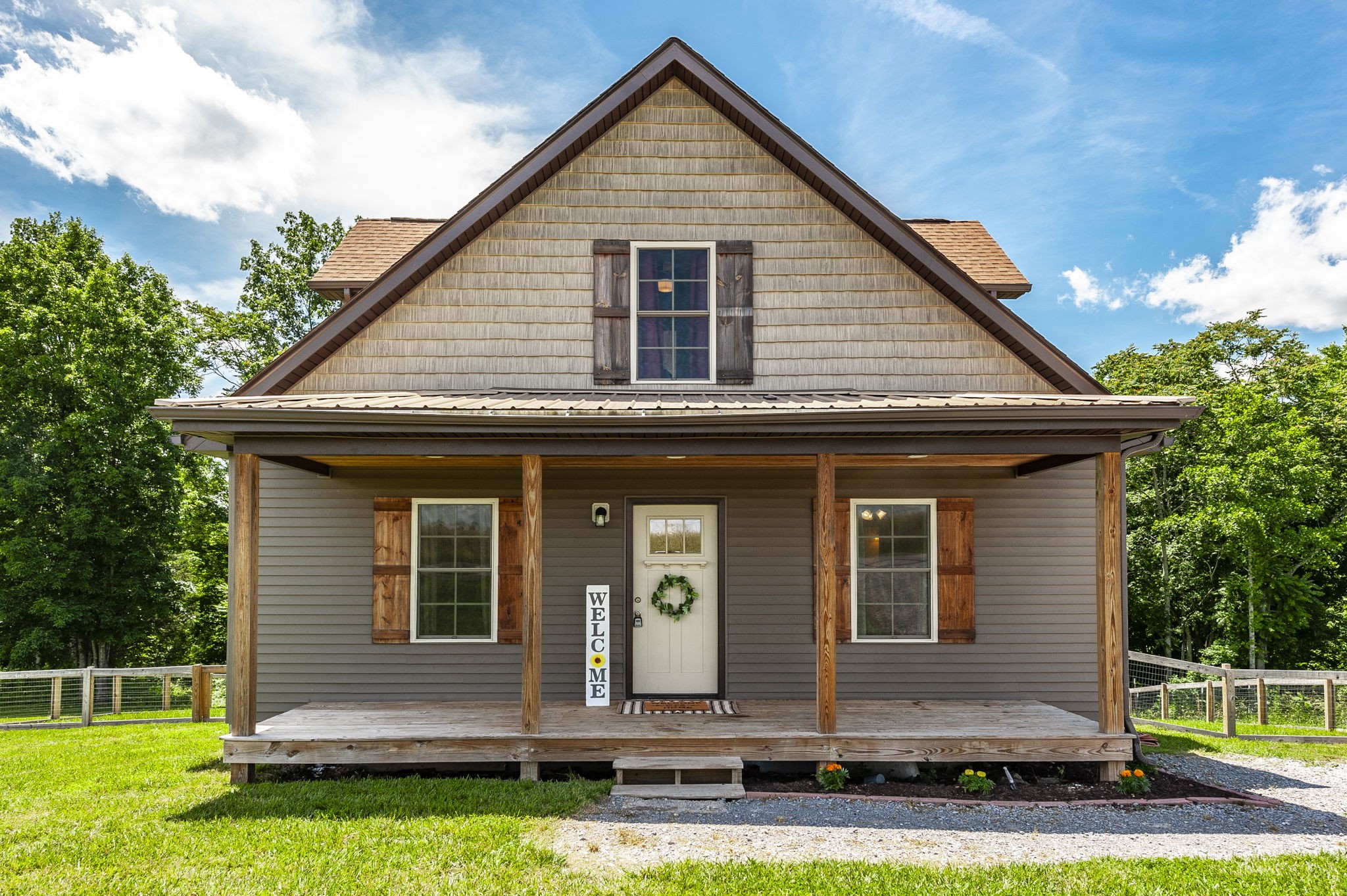 a front view of a house with a yard