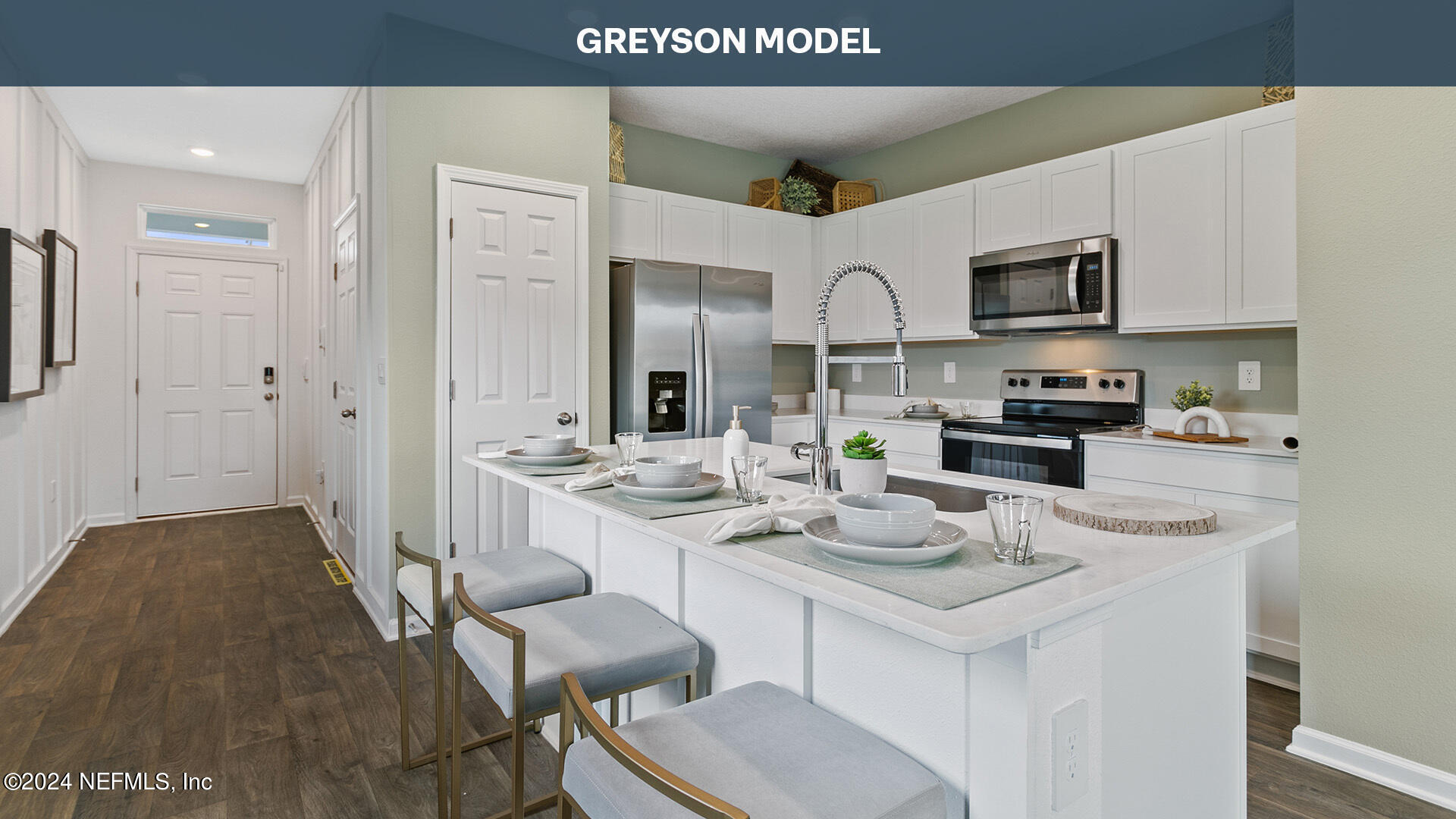 a kitchen with stainless steel appliances kitchen island granite countertop a sink and cabinets