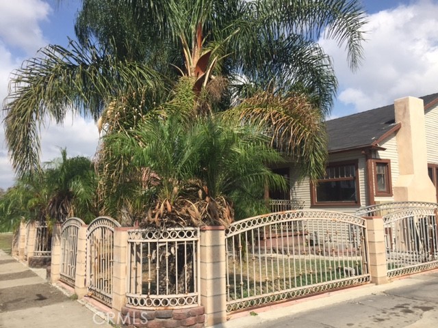 a view of a house with a iron gate