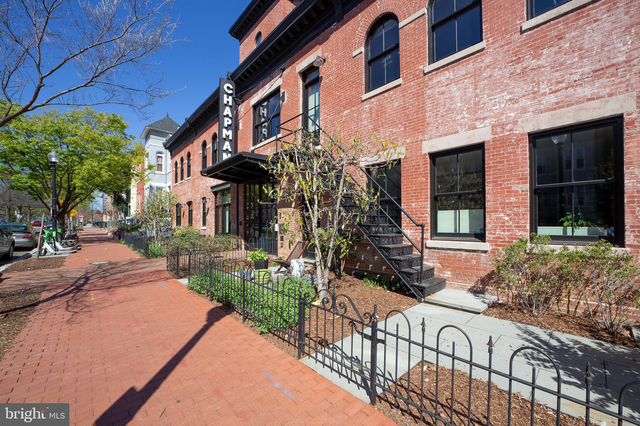 a view of a house with brick walls