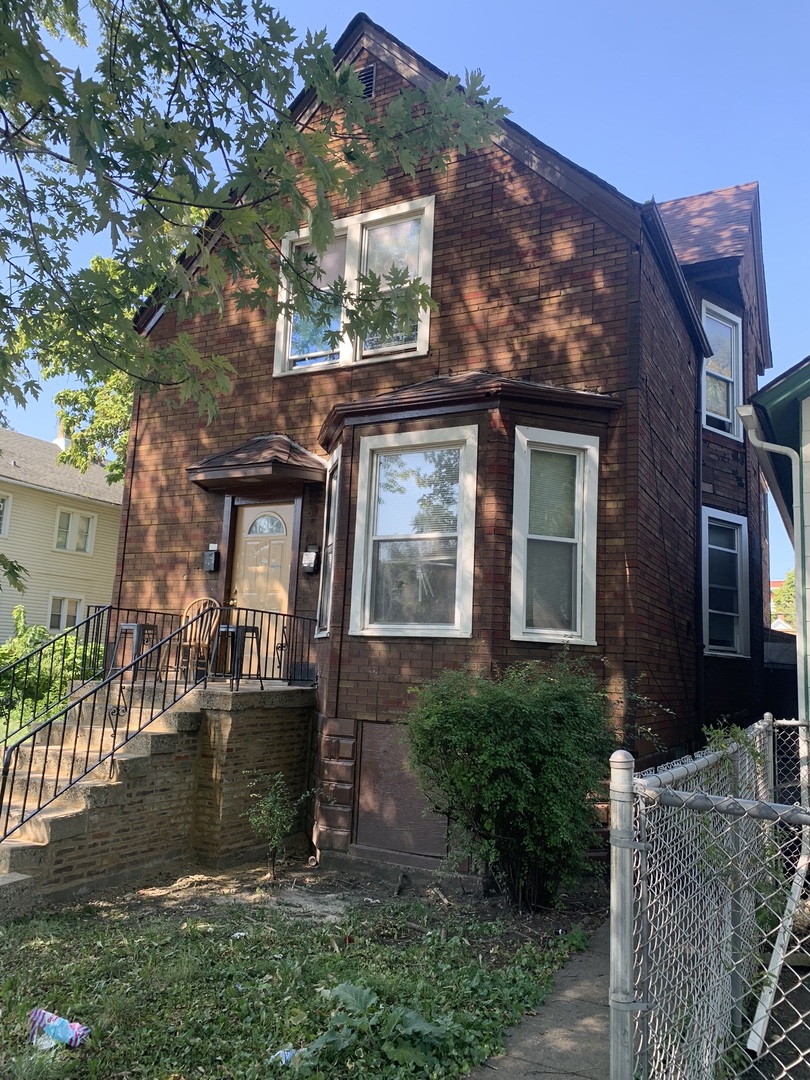 front view of a house with a yard