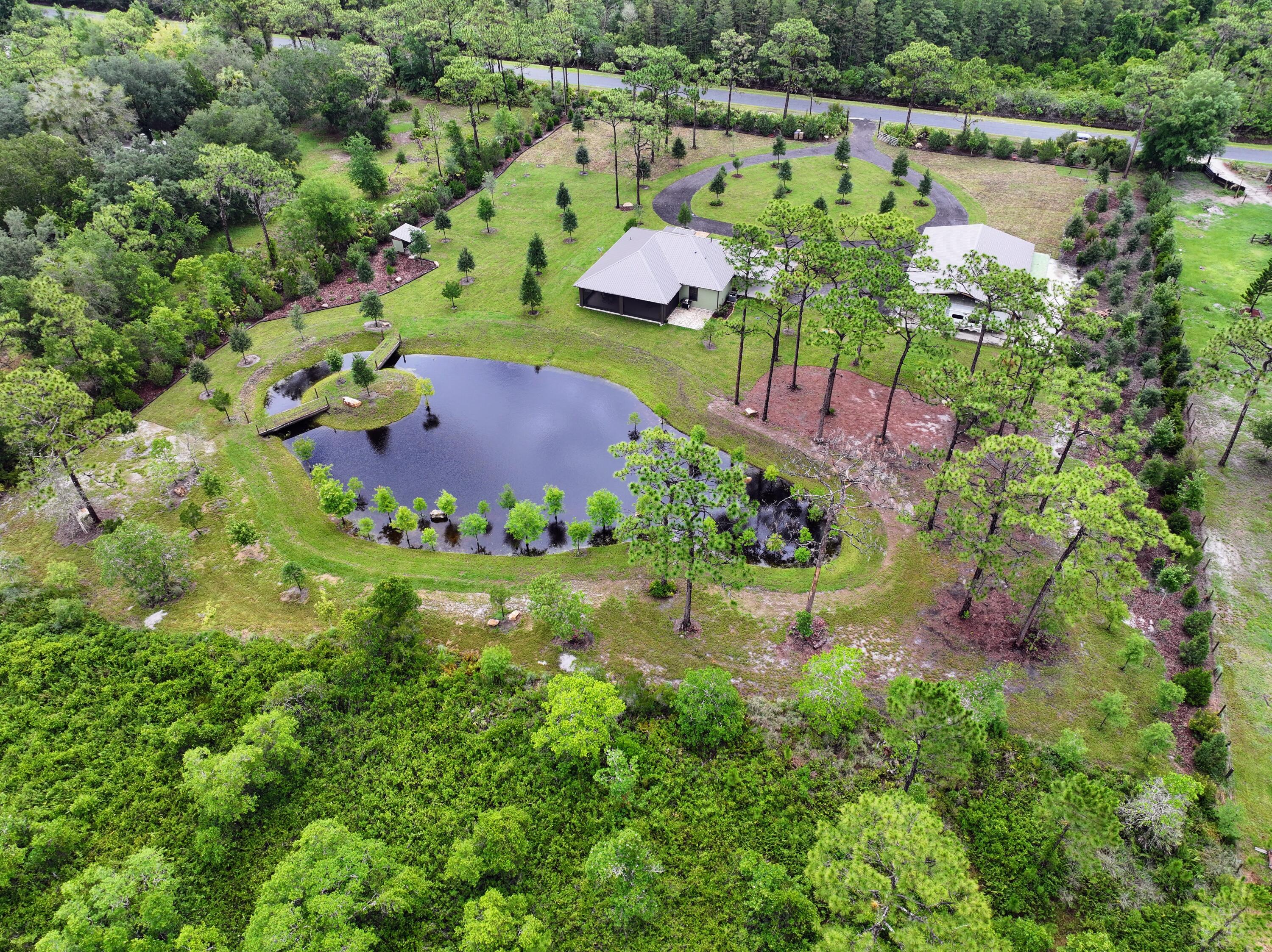 an aerial view of residential house with outdoor space and street view