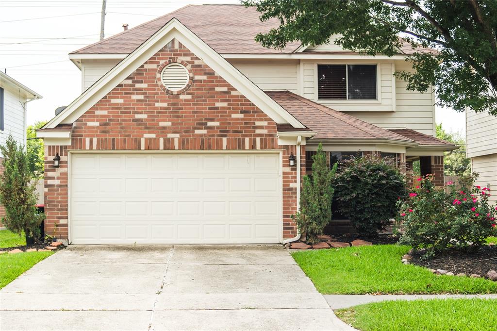 a view of house with yard