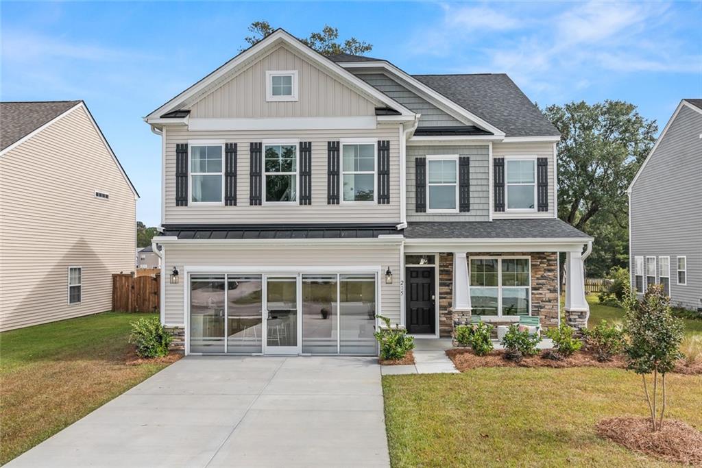 front view of a house with a yard