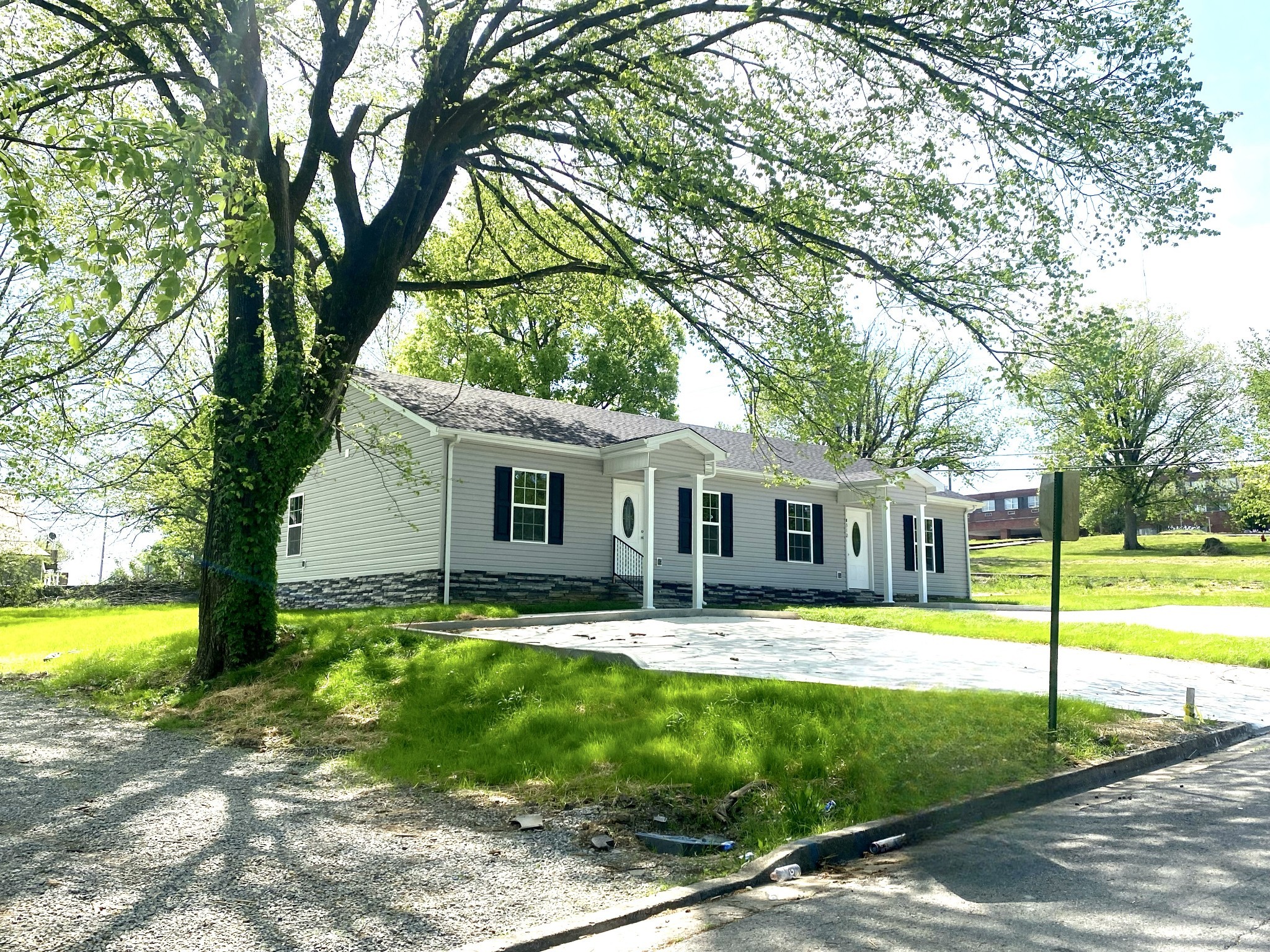 a front view of house with yard and swimming pool