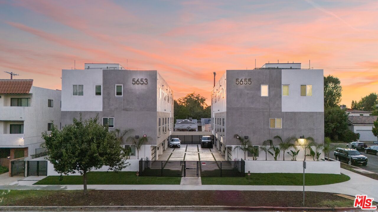 a view of a building with a yard