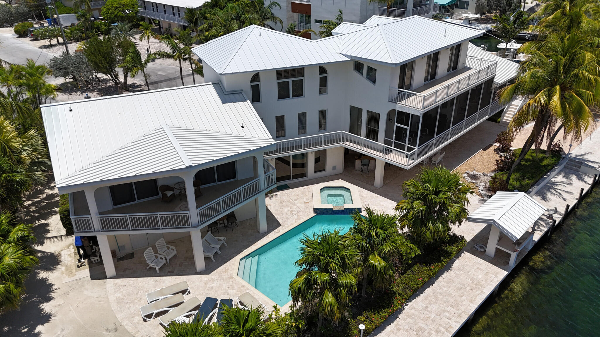 a aerial view of a house with a yard and potted plants