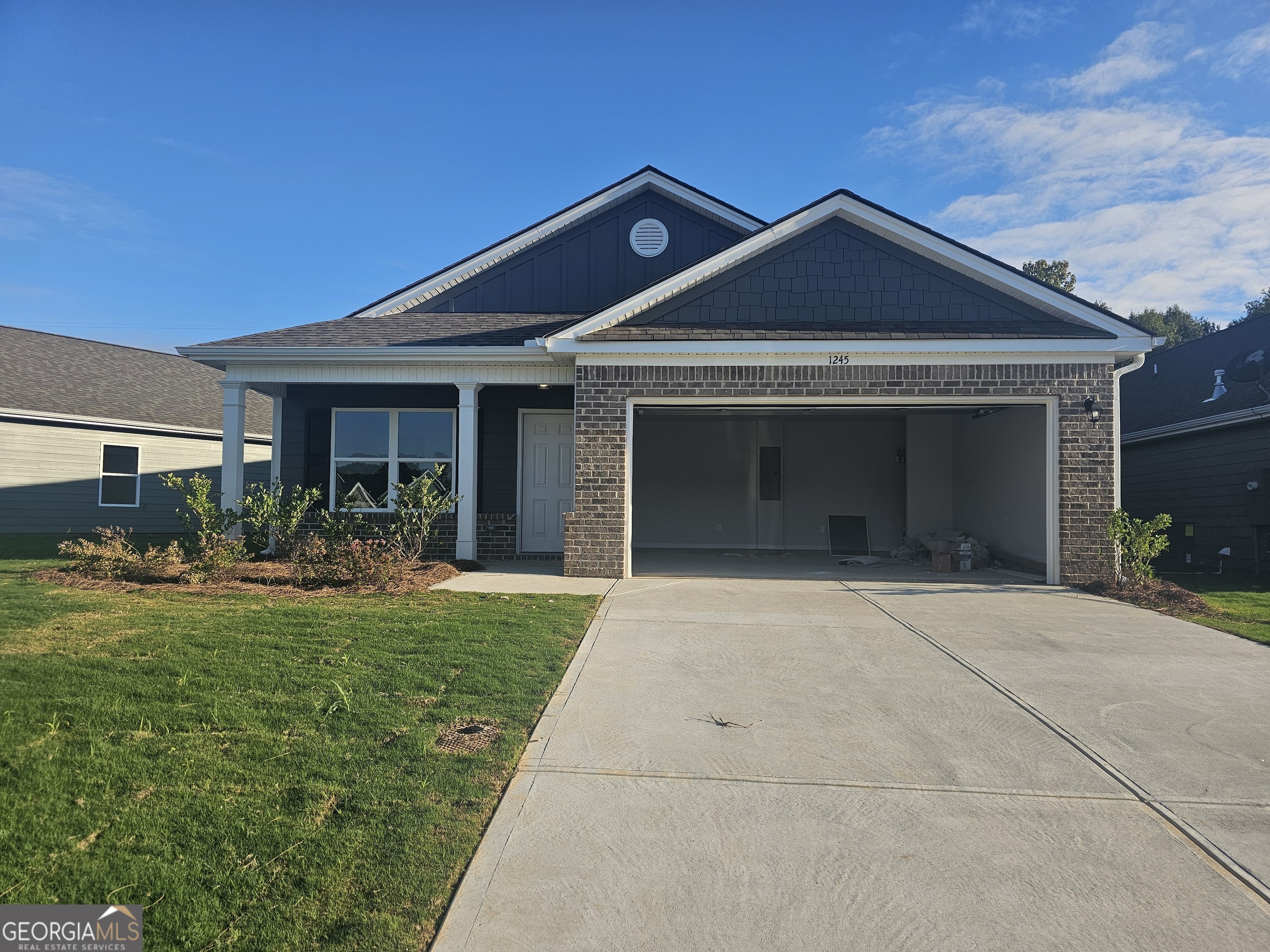 a front view of a house with that has yard