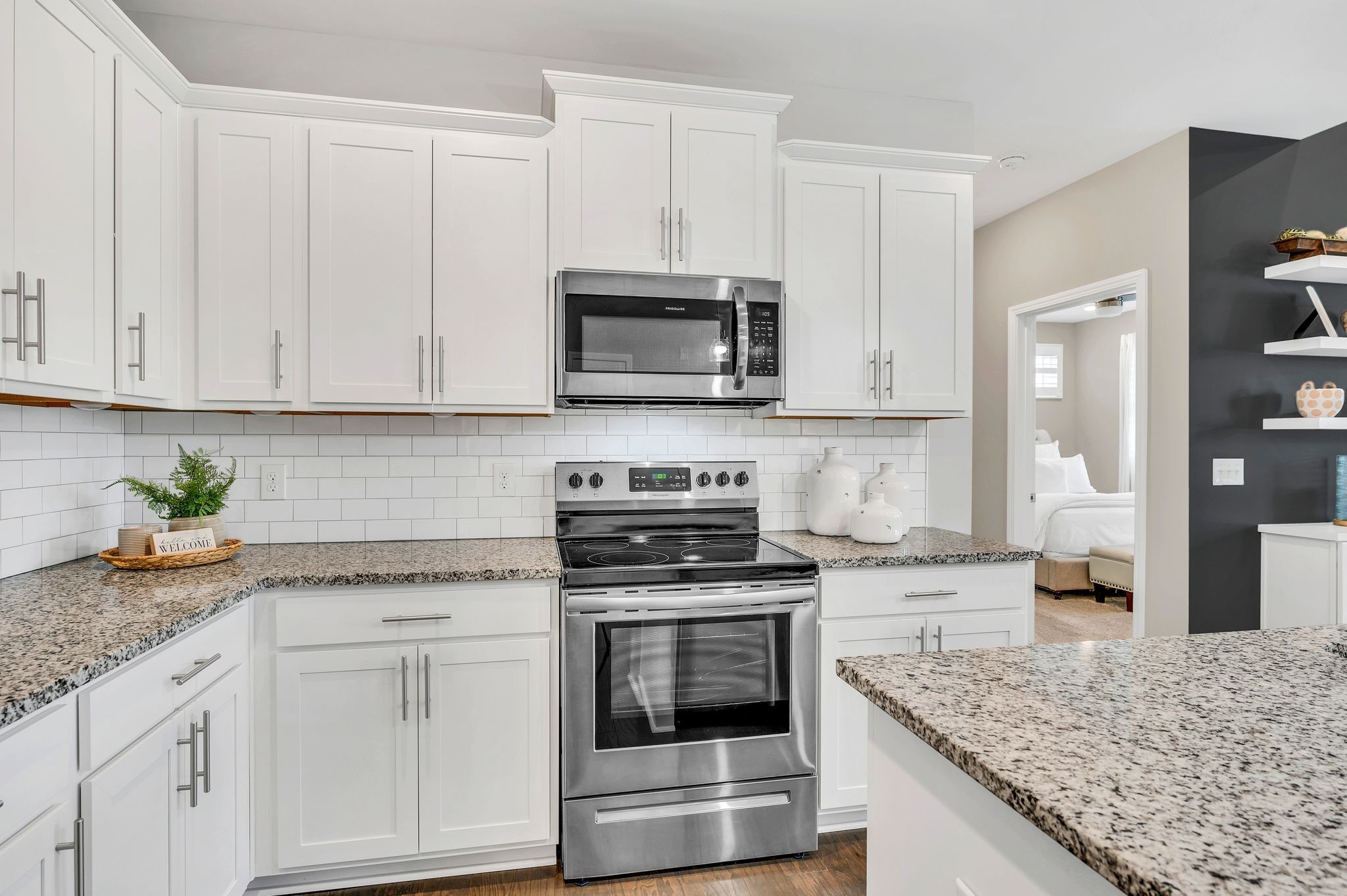 Upgraded Extended Height Cabinets, Under Cabinet Lighting, and Subway Tile Backsplash.