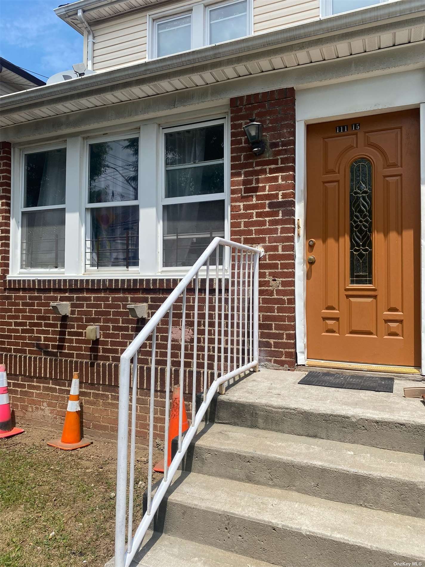 a view of a house with a window and stairs