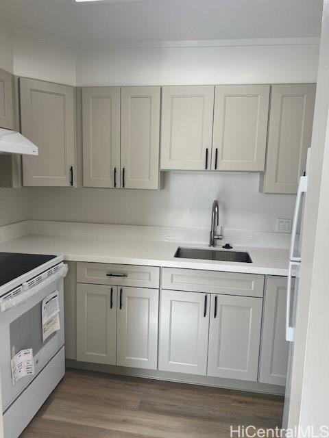 a kitchen with white cabinets white stainless steel appliances and sink