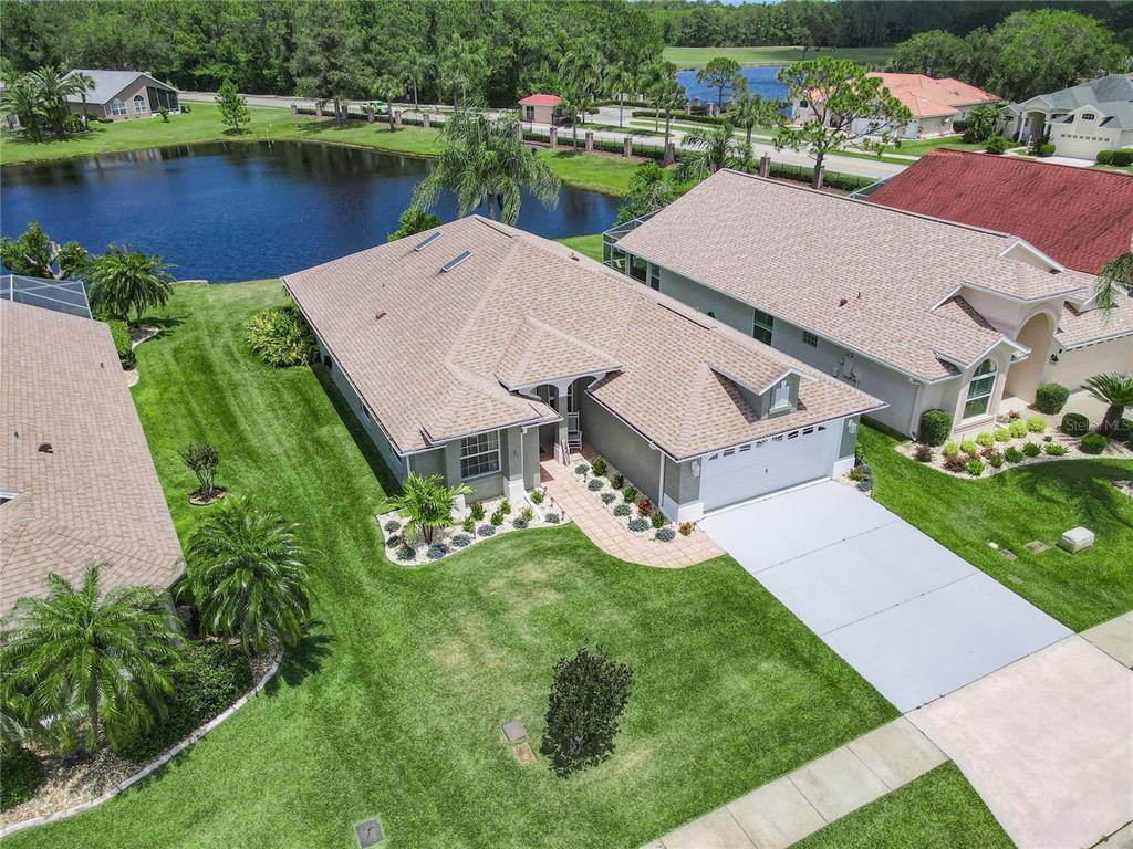 an aerial view of a house with a lake view