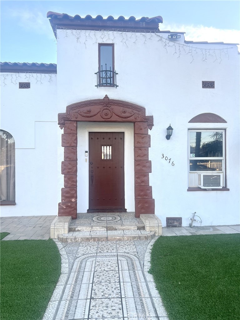 a front view of a house with yard