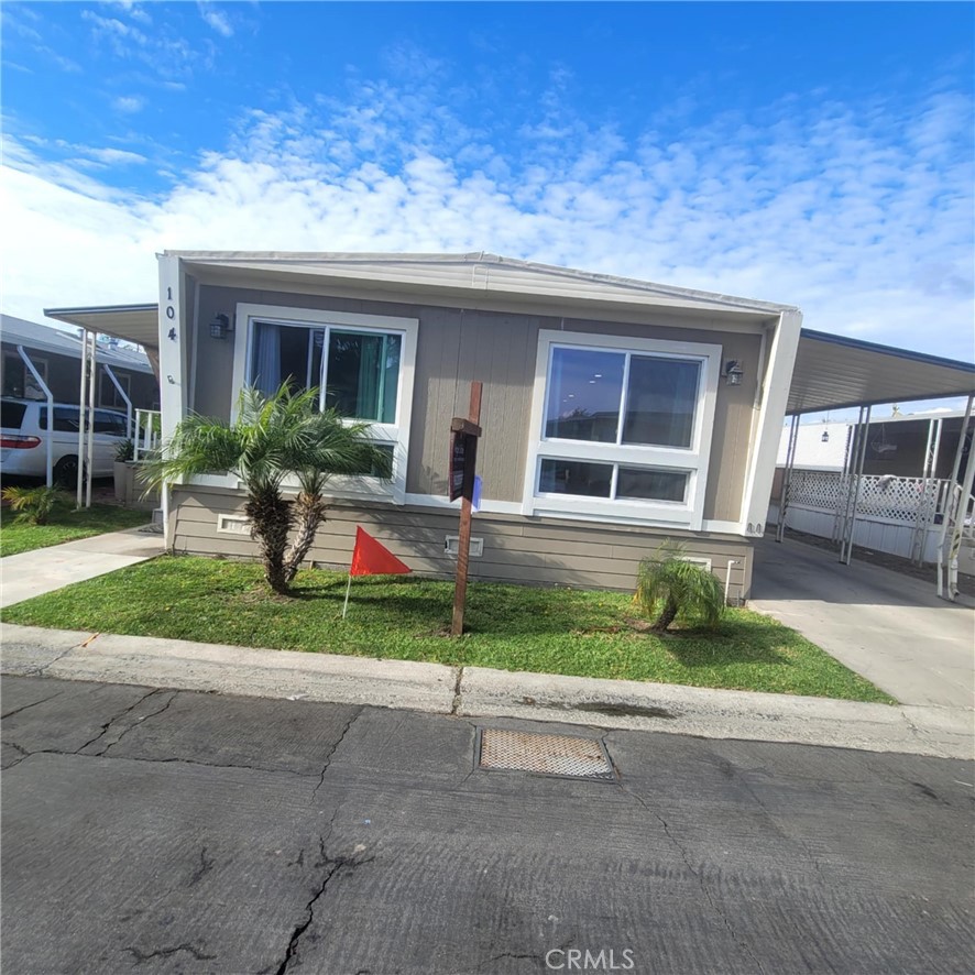 a house view with a garden space and street view