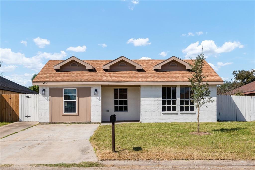 front view of a house with a yard