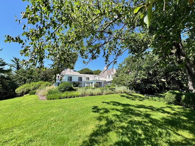 a view of an house with a big yard