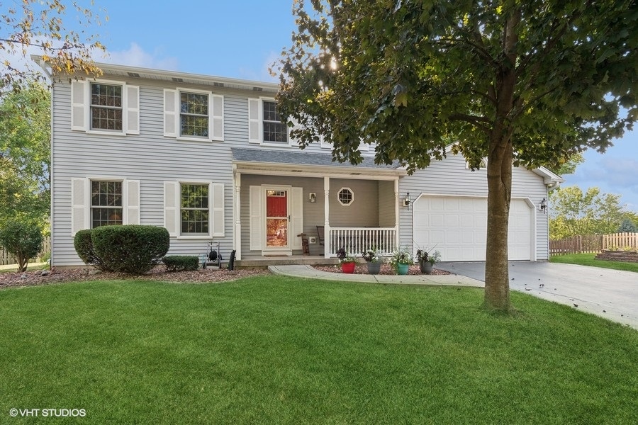 a house view with a sitting space and garden